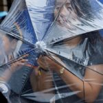 chuva-forte-atinge-pequim-durante-passagem-do-tufao-dolphin